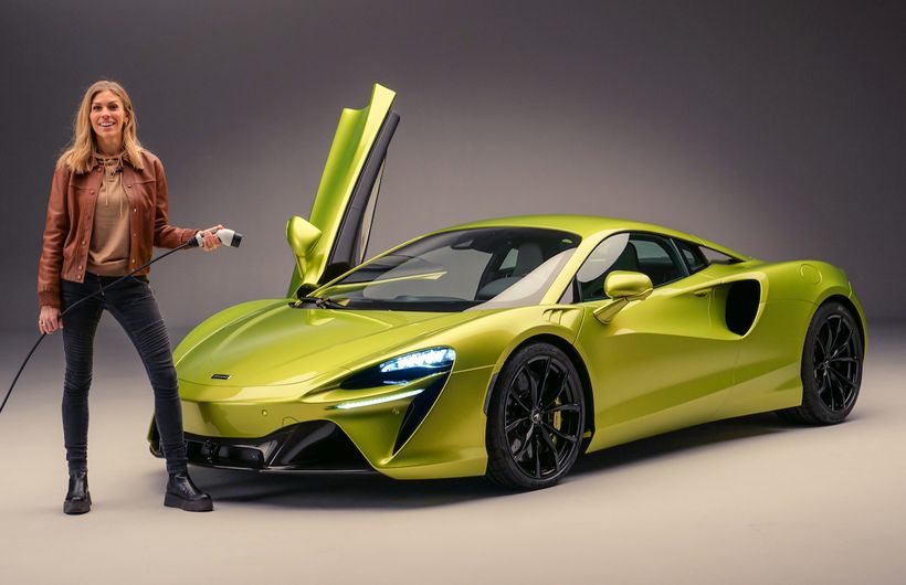 McLaren Artura hybrid supercar Nicki Shields with charging cable